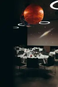 Dining room with planet decorations overhead