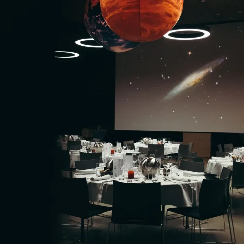 Dining room with planet decorations overhead
